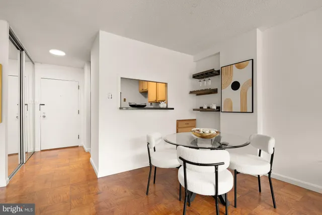 a view of a dining room with furniture and wooden floor