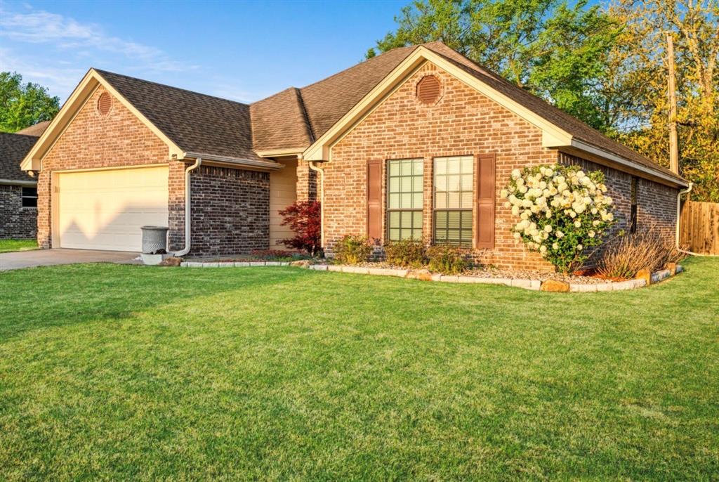 90 44th Street Southwest Paris, TX 75460 - Photo 2 of 17 a view of a house with a yard and sitting area