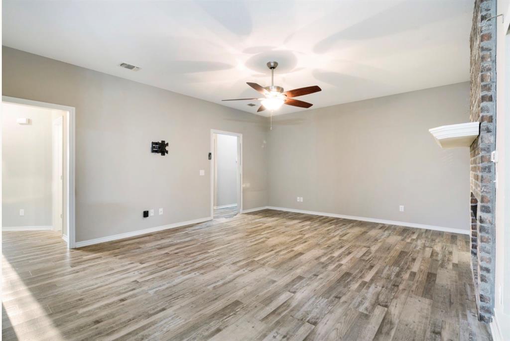 90 44th Street Southwest Paris, TX 75460 - Photo 4 of 17 wooden floor in an empty room