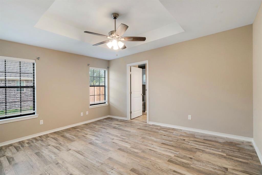 90 44th Street Southwest Paris, TX 75460 - Photo 8 of 17 a view of an empty room with window and wooden floor