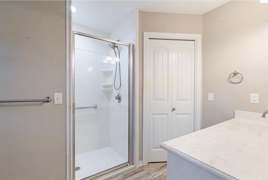 90 44th Street Southwest Paris, TX 75460 - Photo 9 of 17 a bathroom with a shower and sink