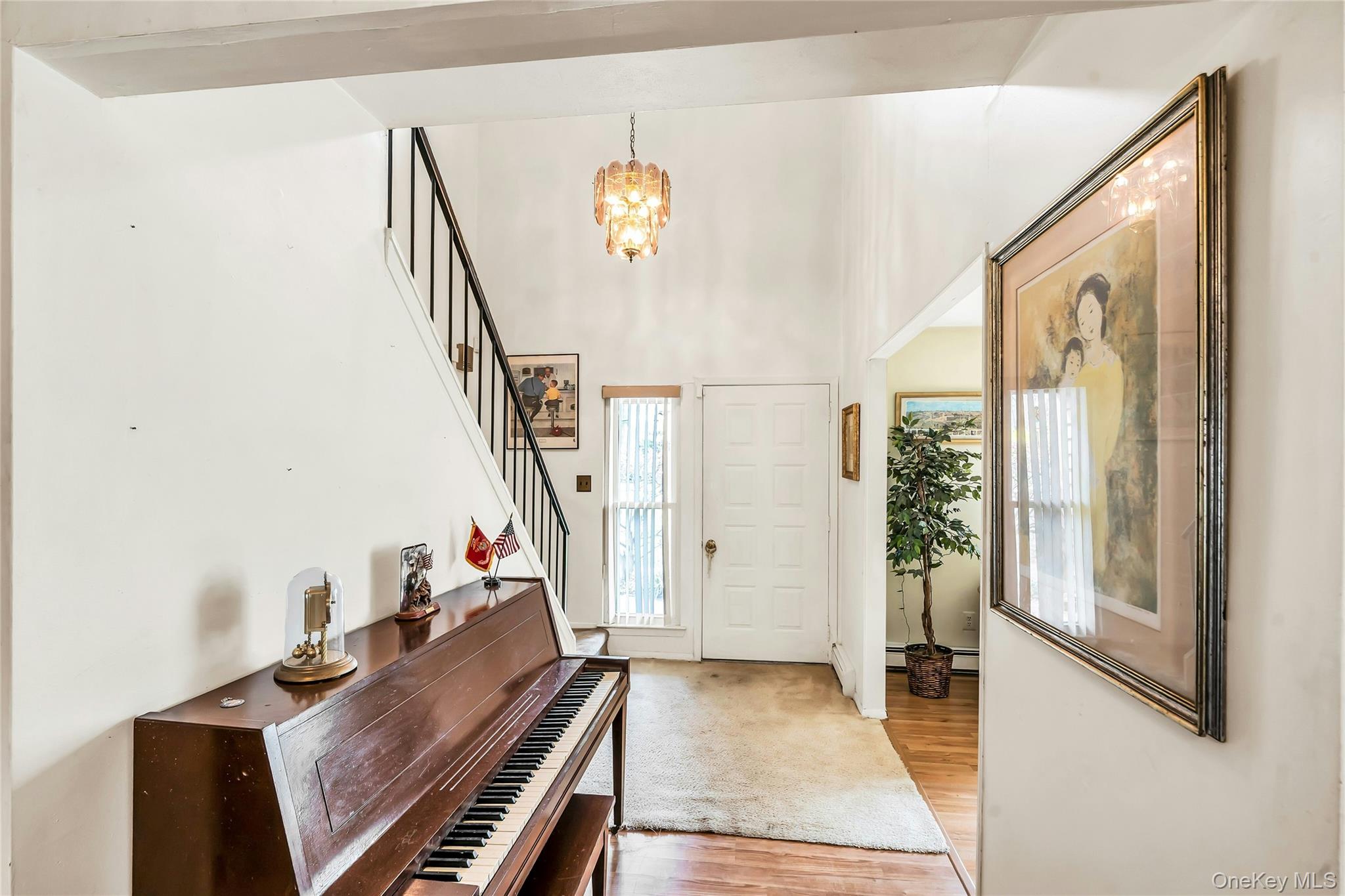 7 Hastings Drive Ridge, NY 11961 - Photo 16 of 33 a view of an entryway with wooden floor