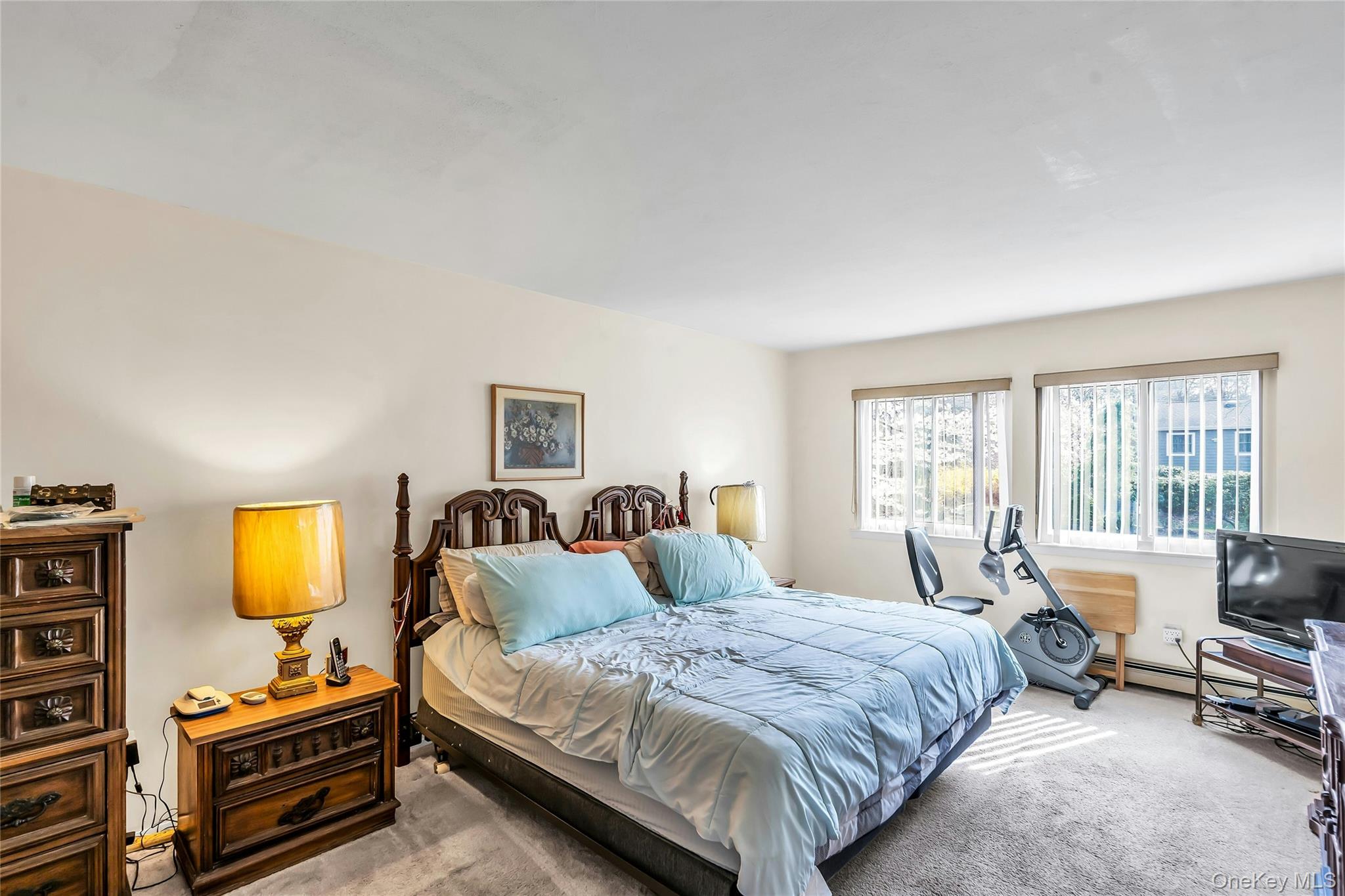 7 Hastings Drive Ridge, NY 11961 - Photo 17 of 33 a bedroom with a bed and wooden floor