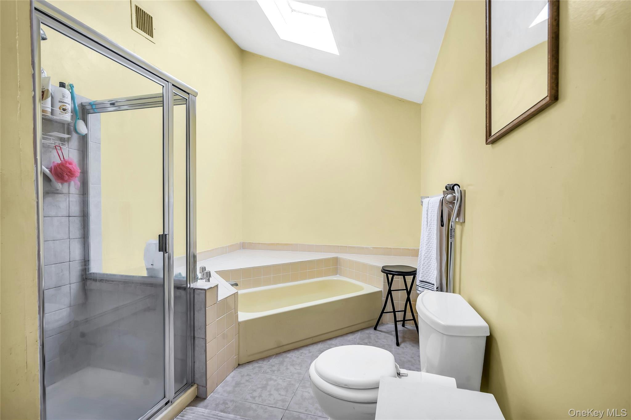 7 Hastings Drive Ridge, NY 11961 - Photo 19 of 33 a bathroom with a toilet a sink and bathtub