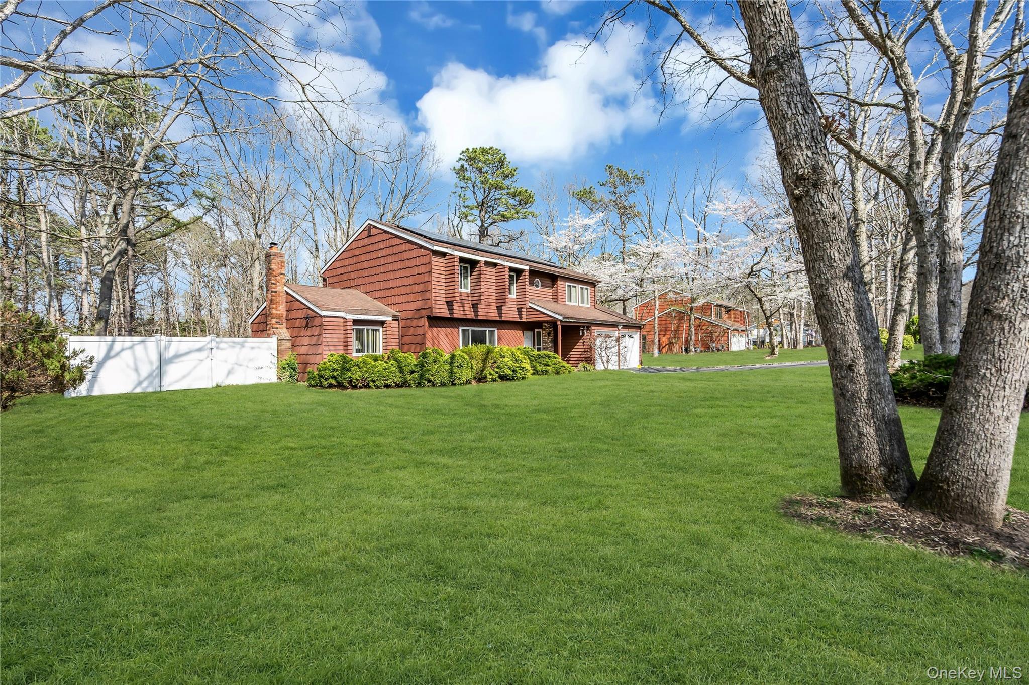 7 Hastings Drive Ridge, NY 11961 - Photo 2 of 33 a front view of a house with garden