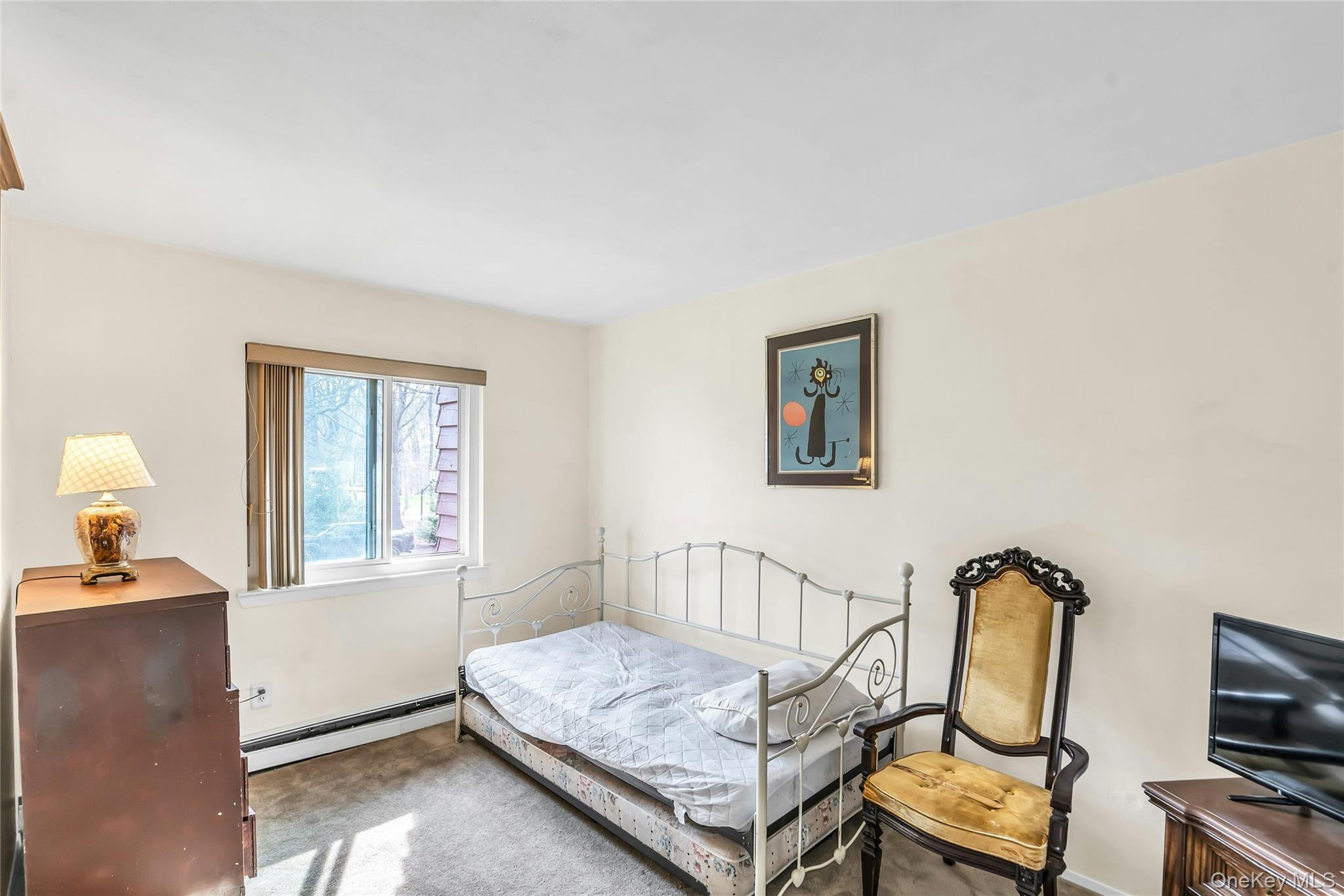 7 Hastings Drive Ridge, NY 11961 - Photo 23 of 33 a bedroom with furniture and a window
