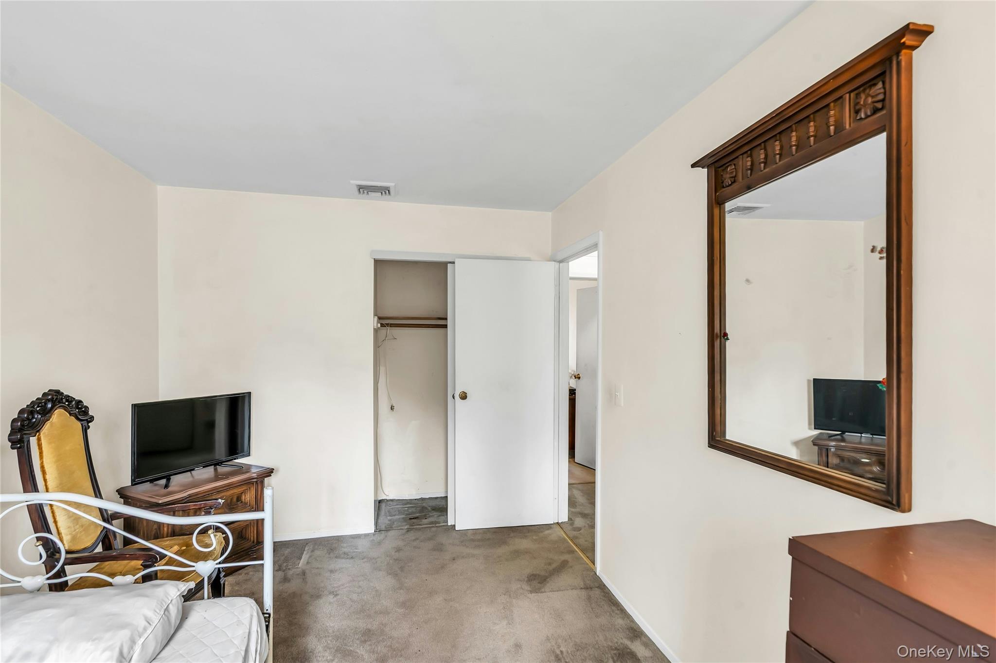 7 Hastings Drive Ridge, NY 11961 - Photo 24 of 33 a view of a workspace with furniture and a flat screen tv
