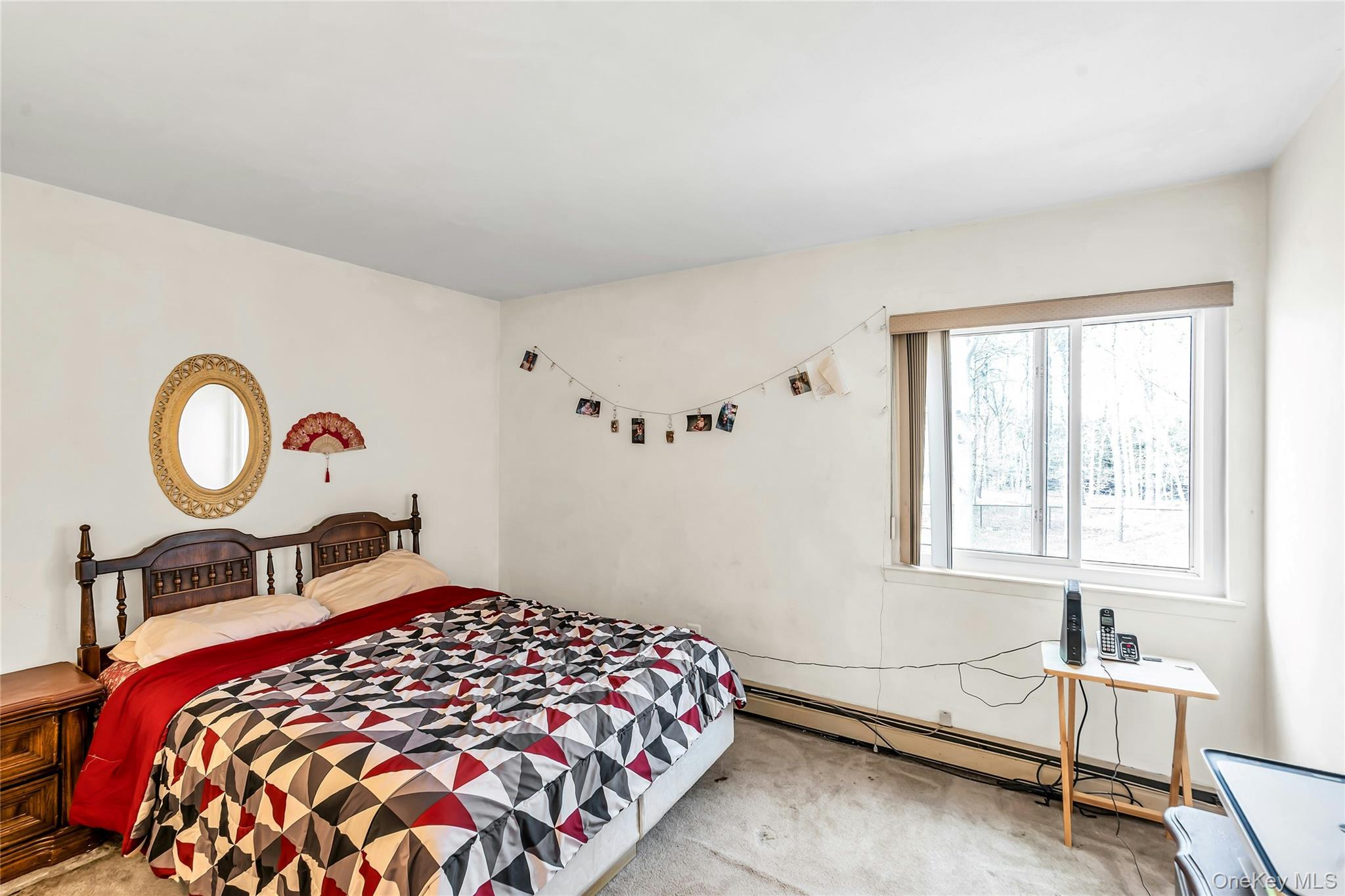 7 Hastings Drive Ridge, NY 11961 - Photo 25 of 33 a bedroom with a bed and a window