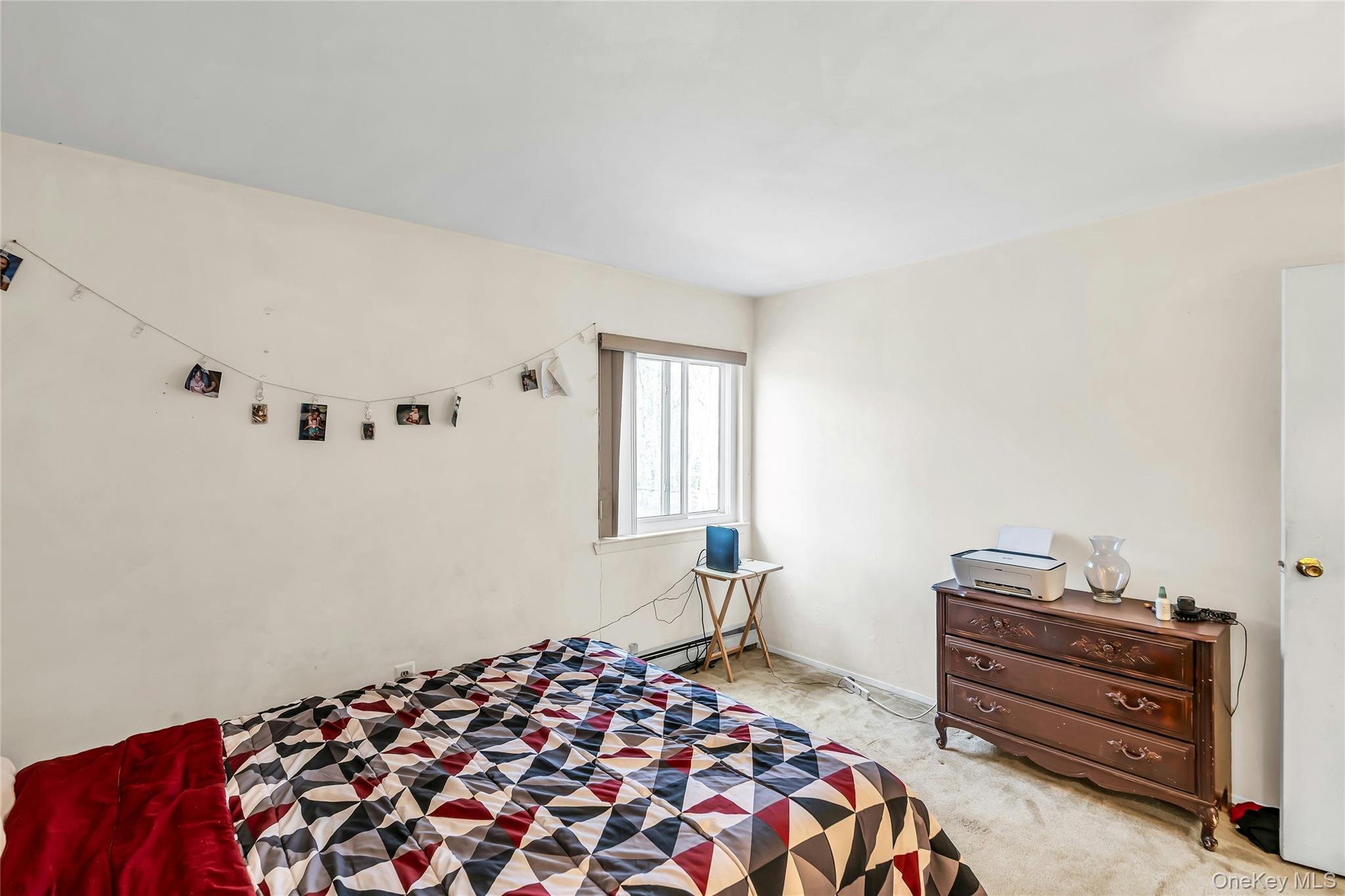 7 Hastings Drive Ridge, NY 11961 - Photo 26 of 33 a bedroom with a bed and a dresser