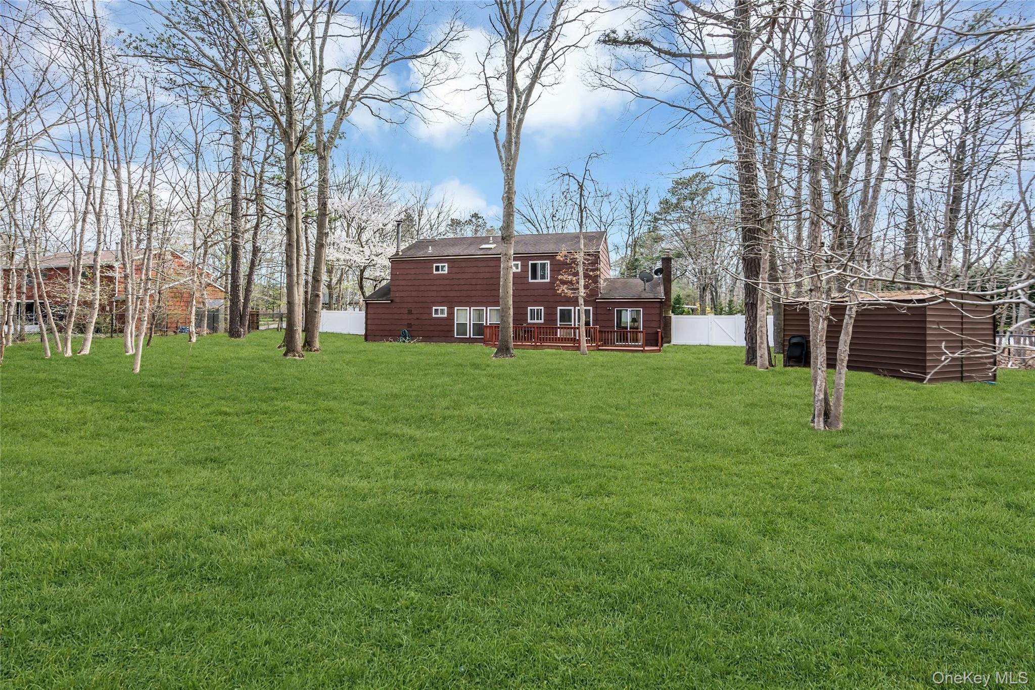 7 Hastings Drive Ridge, NY 11961 - Photo 30 of 33 a view of a yard with large trees