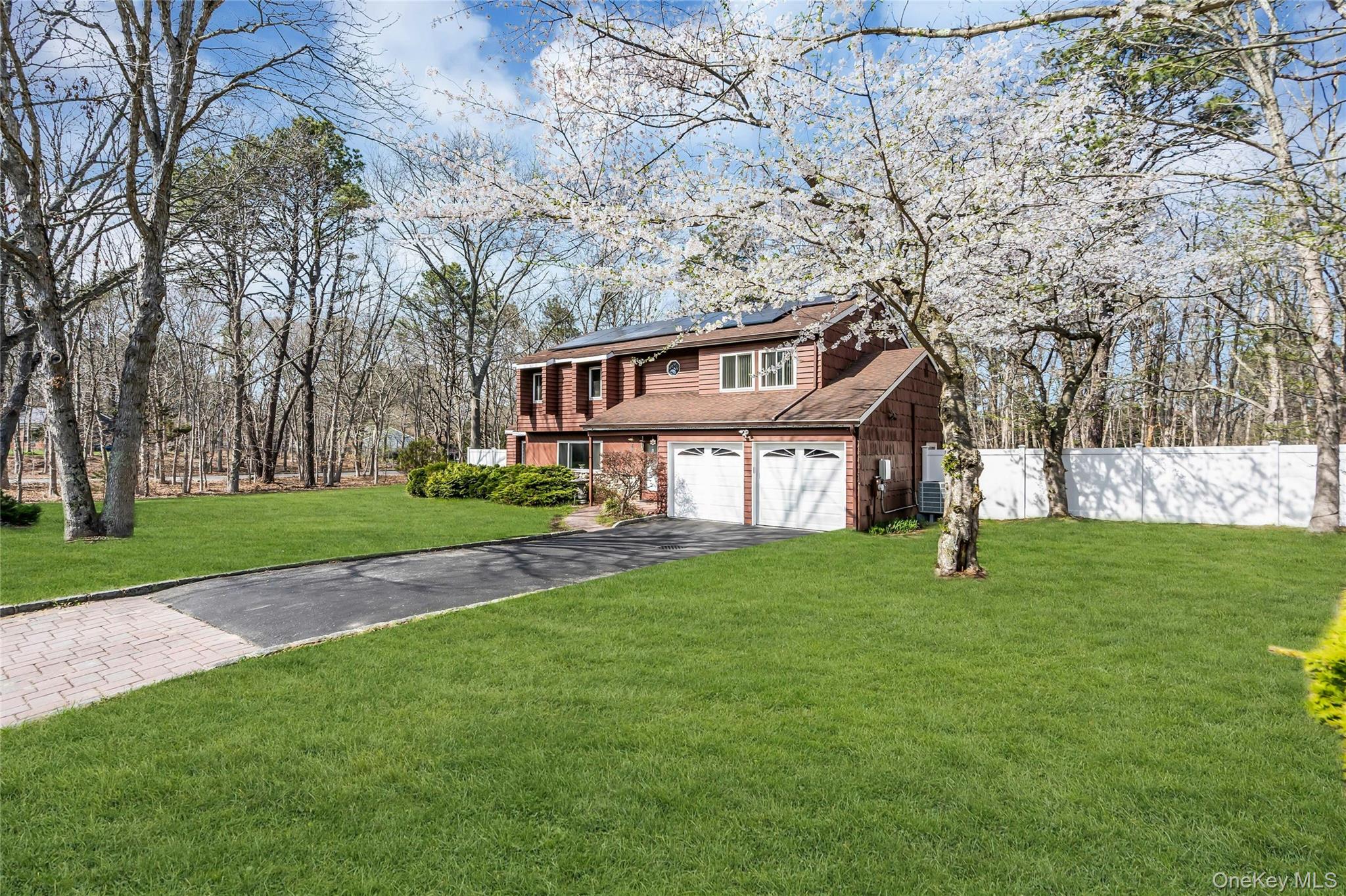7 Hastings Drive Ridge, NY 11961 - Photo 3 of 33 a view of a house with a big yard and large trees