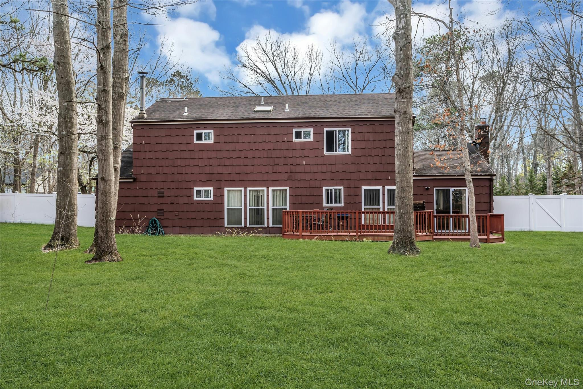7 Hastings Drive Ridge, NY 11961 - Photo 31 of 33 a view of a house with a yard