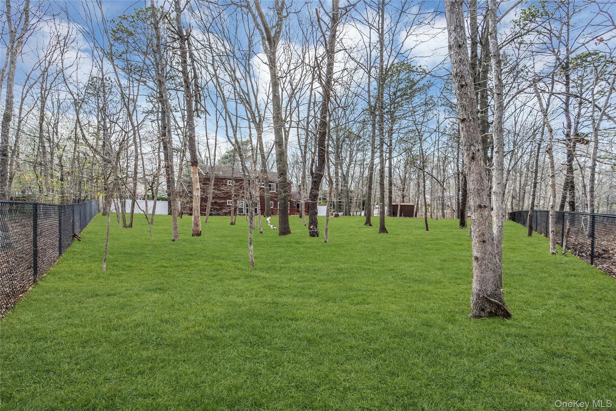 7 Hastings Drive Ridge, NY 11961 - Photo 32 of 33 a view of a park with tree s