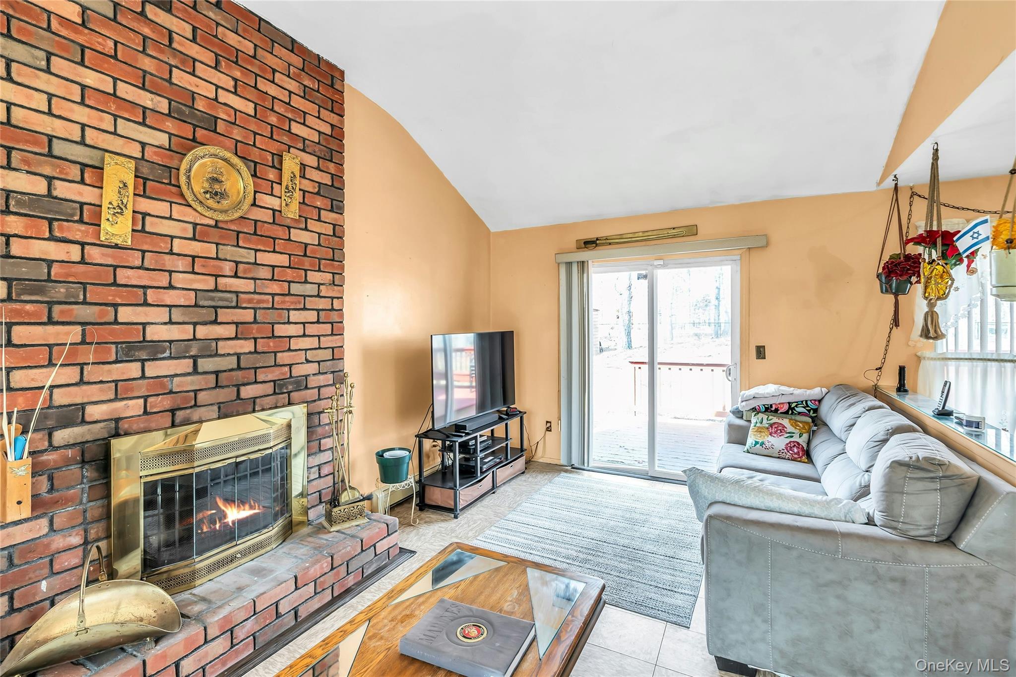 7 Hastings Drive Ridge, NY 11961 - Photo 7 of 33 a living room with furniture and a fireplace