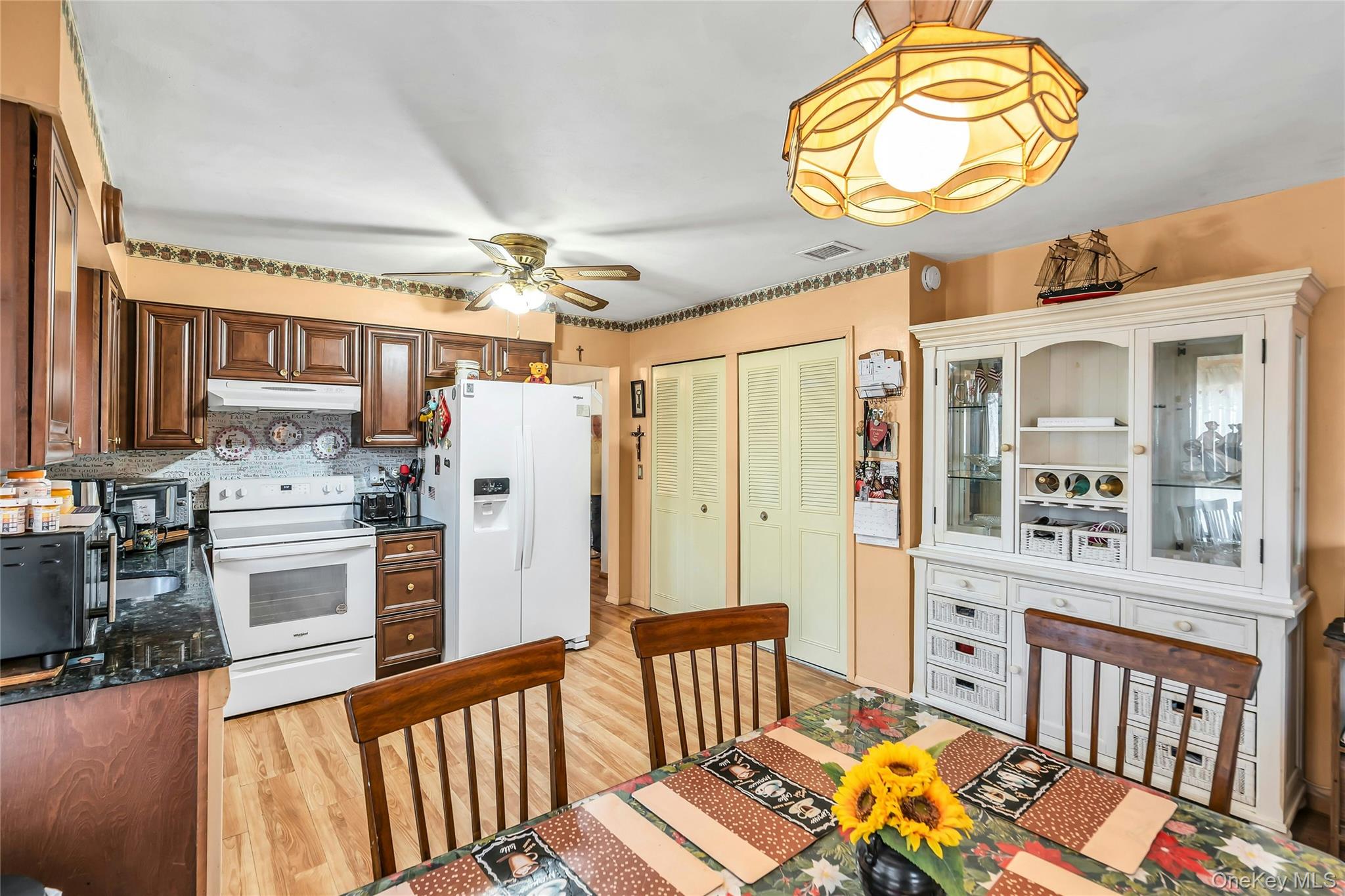 7 Hastings Drive Ridge, NY 11961 - Photo 9 of 33 a view of a kitchen from a dining room