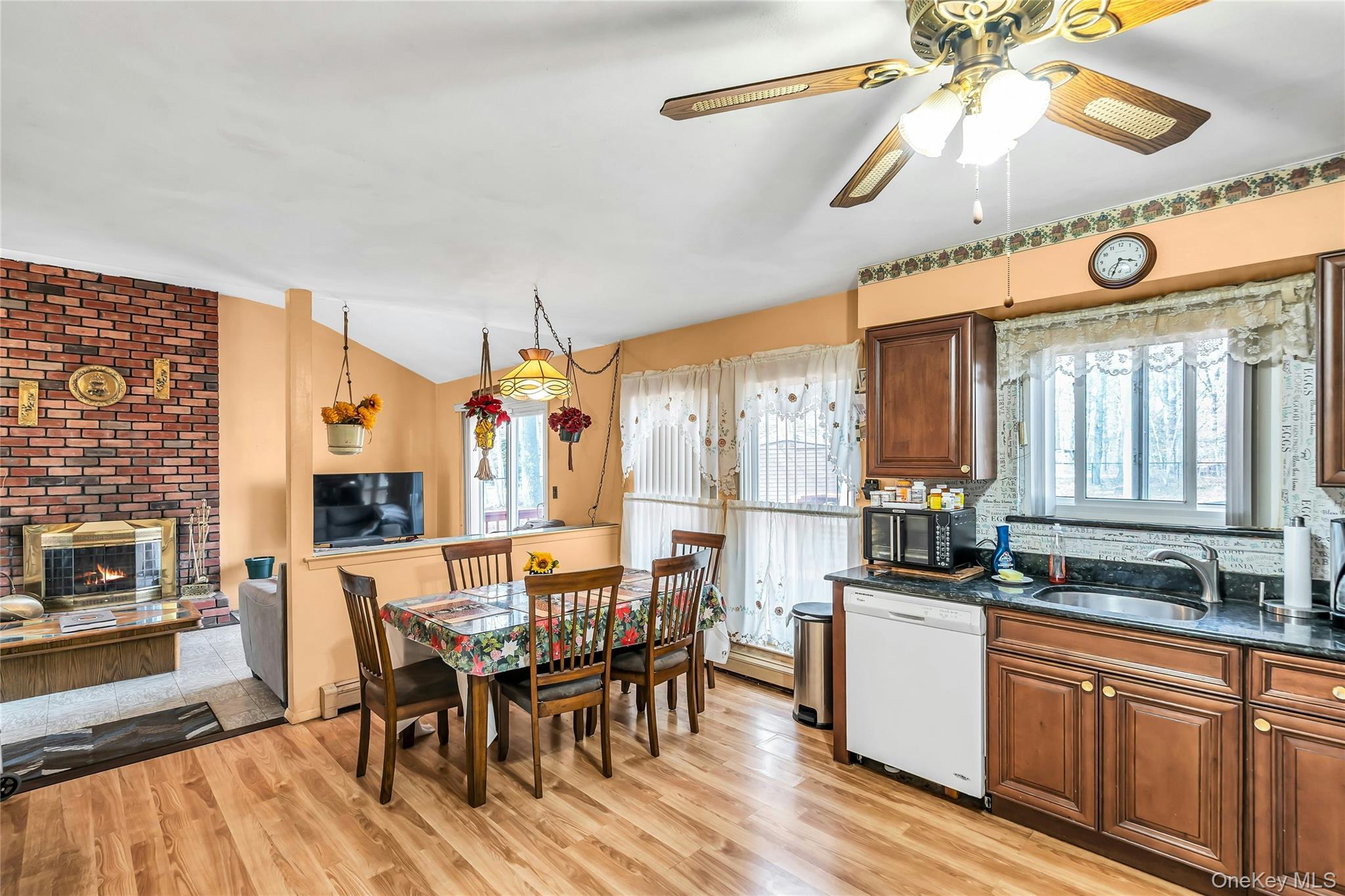 7 Hastings Drive Ridge, NY 11961 - Photo 10 of 33 a view of a dining room with furniture window and wooden floor