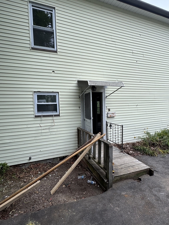 22 Belknap Street Concord, MA 01742 - Photo 13 of 15 a view of a house with a small deck