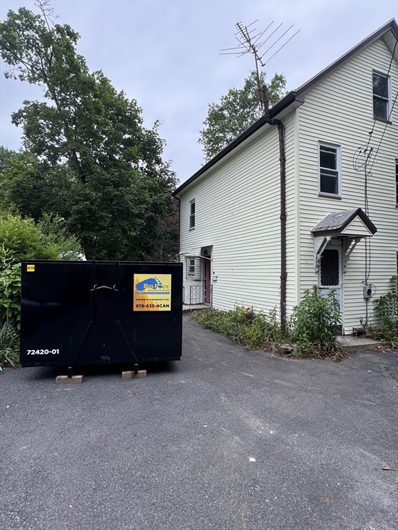 22 Belknap Street Concord, MA 01742 - Photo 2 of 15 a car parked in front of a white house