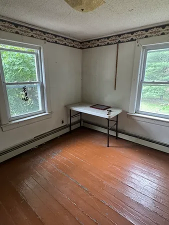 a room with window and a wooden floor