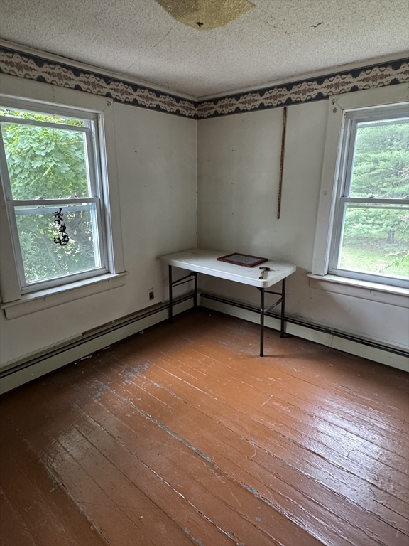 22 Belknap Street Concord, MA 01742 - Photo 5 of 15 a room with window and a wooden floor