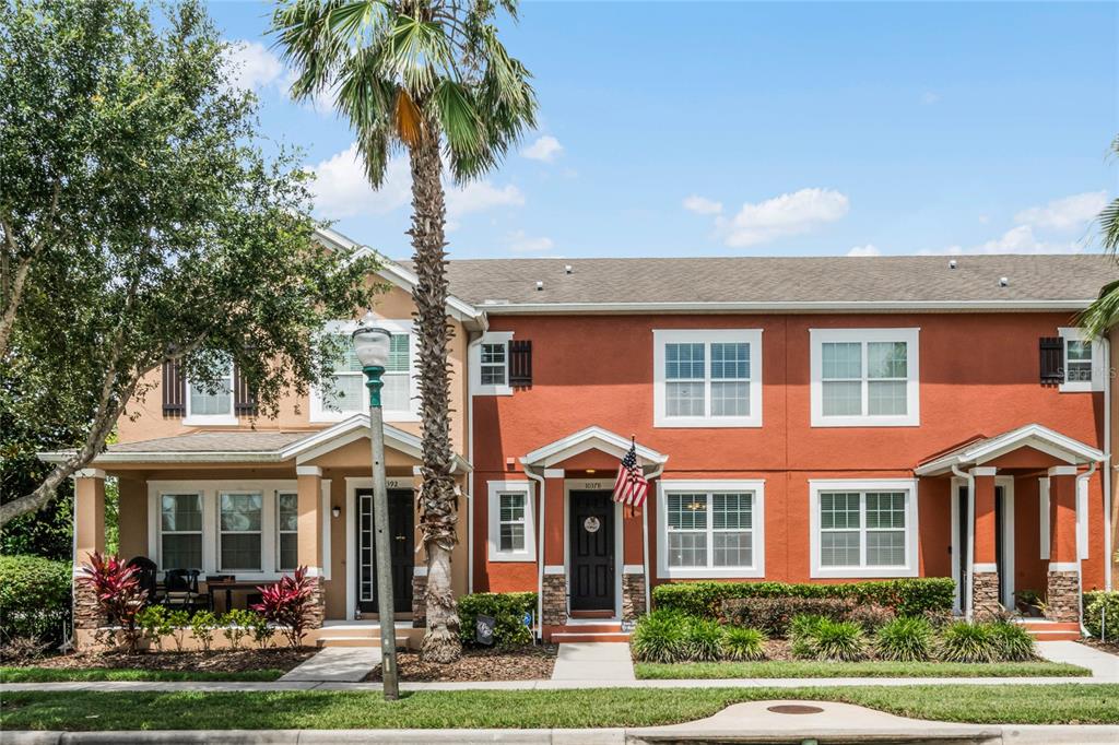 10378 Hartford Maroon Road Orlando, FL 32827 - Photo 1 of 1 front view of a brick house with a yard and potted plants