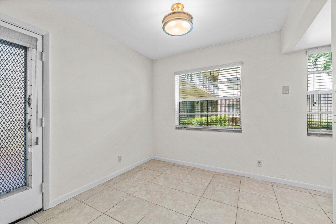 641 Normandy Lane, Unit N Delray Beach, FL 33484 - Photo 15 of 26 an empty room with windows