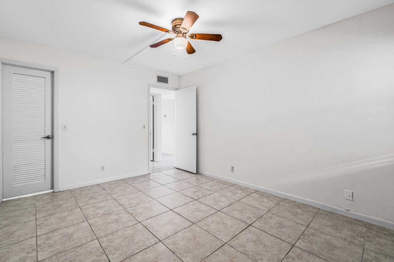 641 Normandy Lane, Unit N Delray Beach, FL 33484 - Photo 17 of 26 a view of an empty room