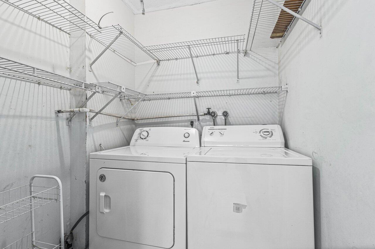 641 Normandy Lane, Unit N Delray Beach, FL 33484 - Photo 20 of 26 a utility room with dryer and washer