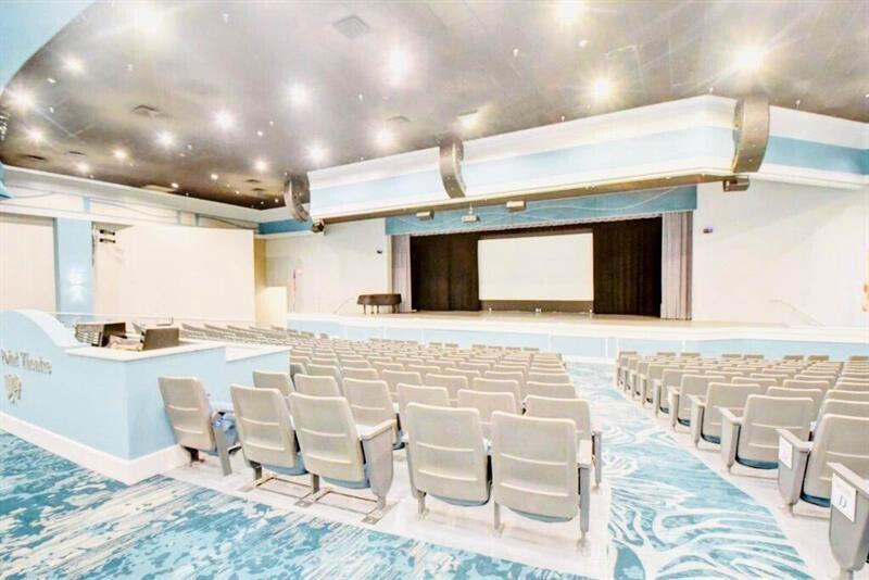 641 Normandy Lane, Unit N Delray Beach, FL 33484 - Photo 25 of 26 a living room with couches and kitchen view with wooden floor