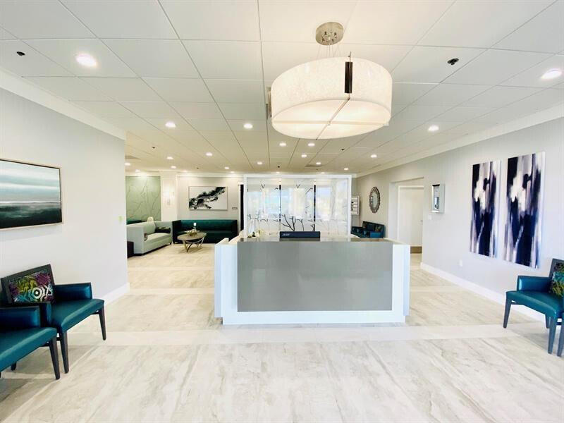 641 Normandy Lane, Unit N Delray Beach, FL 33484 - Photo 26 of 26 a view of a living room and a kitchen