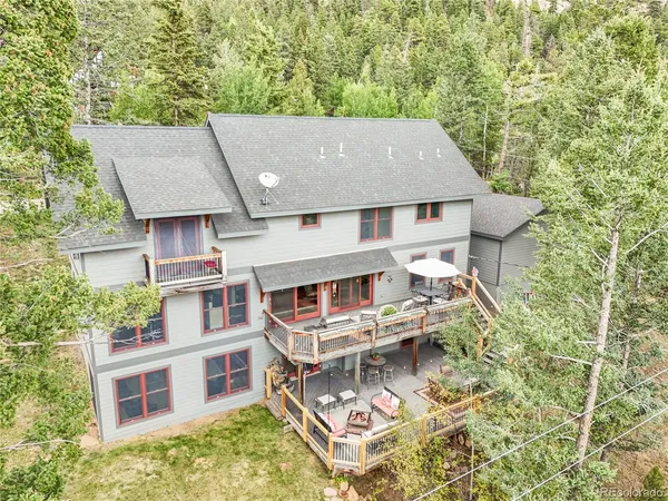 aerial view of a house with roof deck front of house