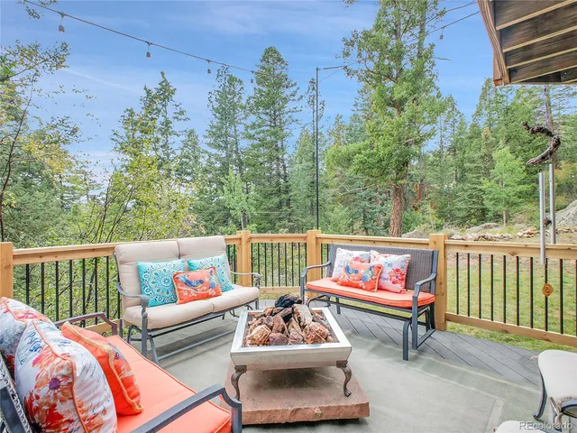 a view of a chairs and table in the balcony