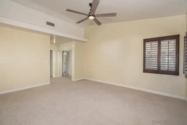 an aerial view of a house with a yard and garden