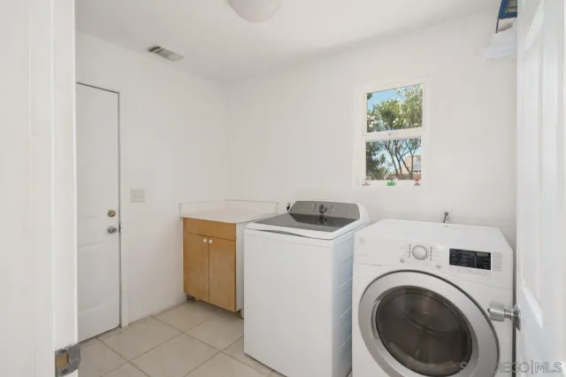 a view of a house with backyard porch and sitting area
