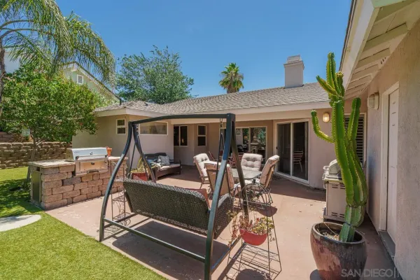 a view of a house with a yard and a garage