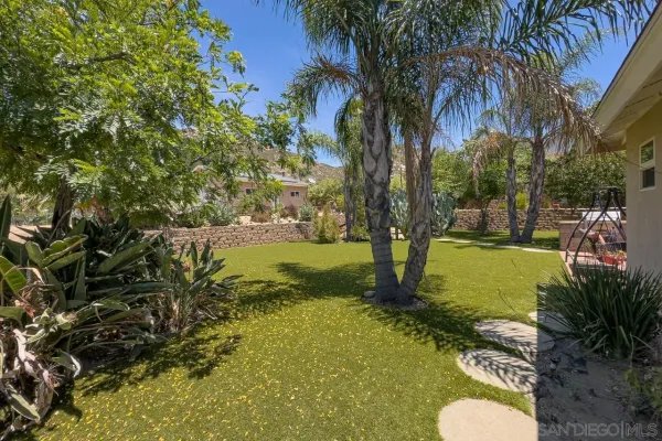 an aerial view of a house with a garden and plants