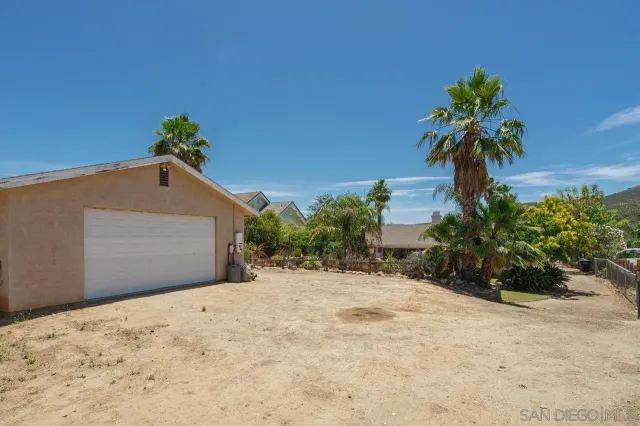 an aerial view of house with yard