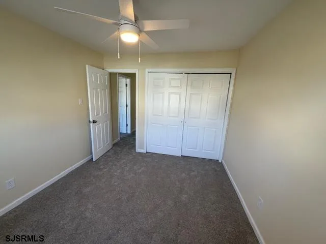 an empty room with closet area