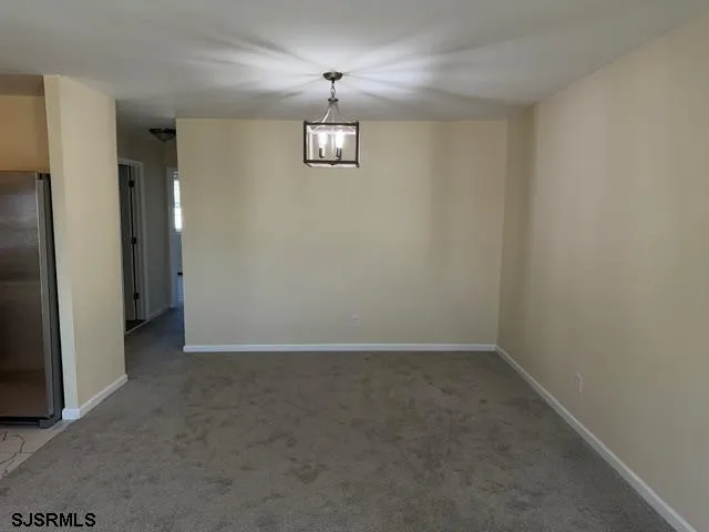 an empty room with a empty space and a window