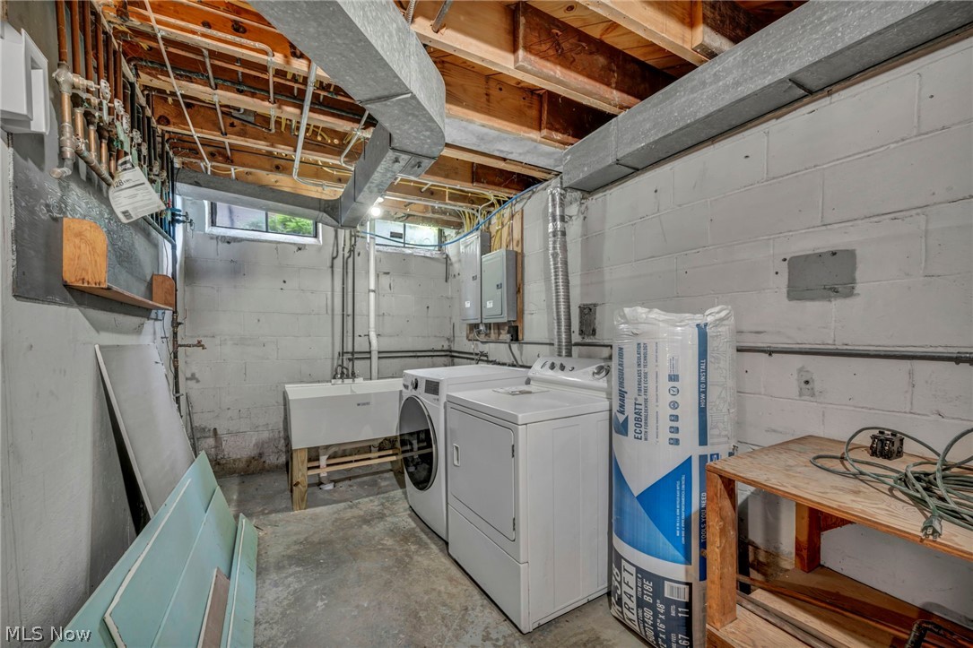 3543 Lytle Road Shaker Heights, OH 44122 - Photo 44 of 49 Utility area featuring exposed ceiling joists, concrete block walls, a utility sink, and a window