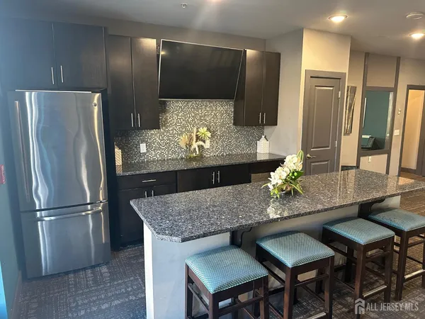 a room with gym equipment and a flat screen tv