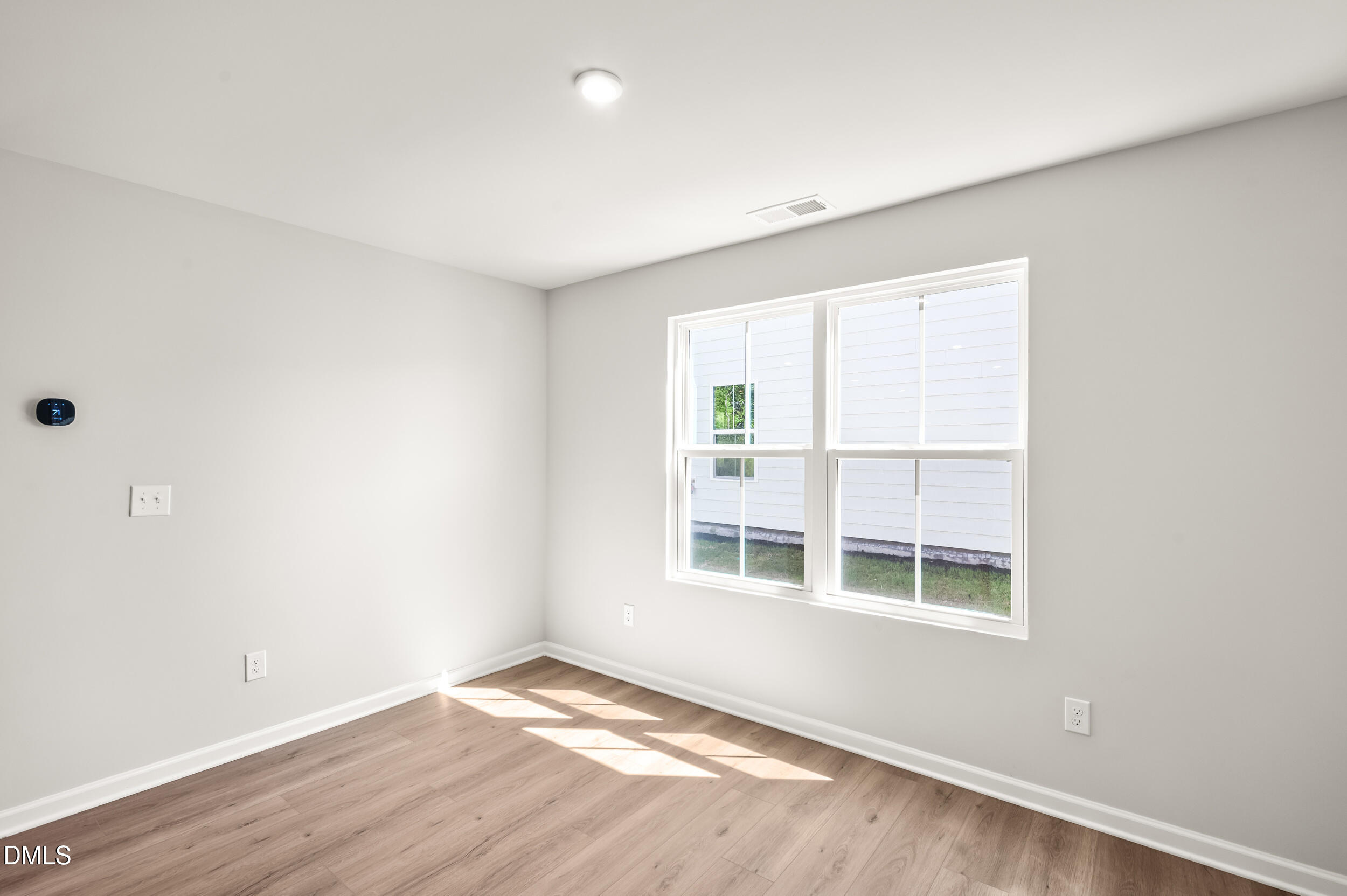 129 Cavalier Rider Run Wendell, NC 27591 - Photo 7 of 38 an empty room with a window