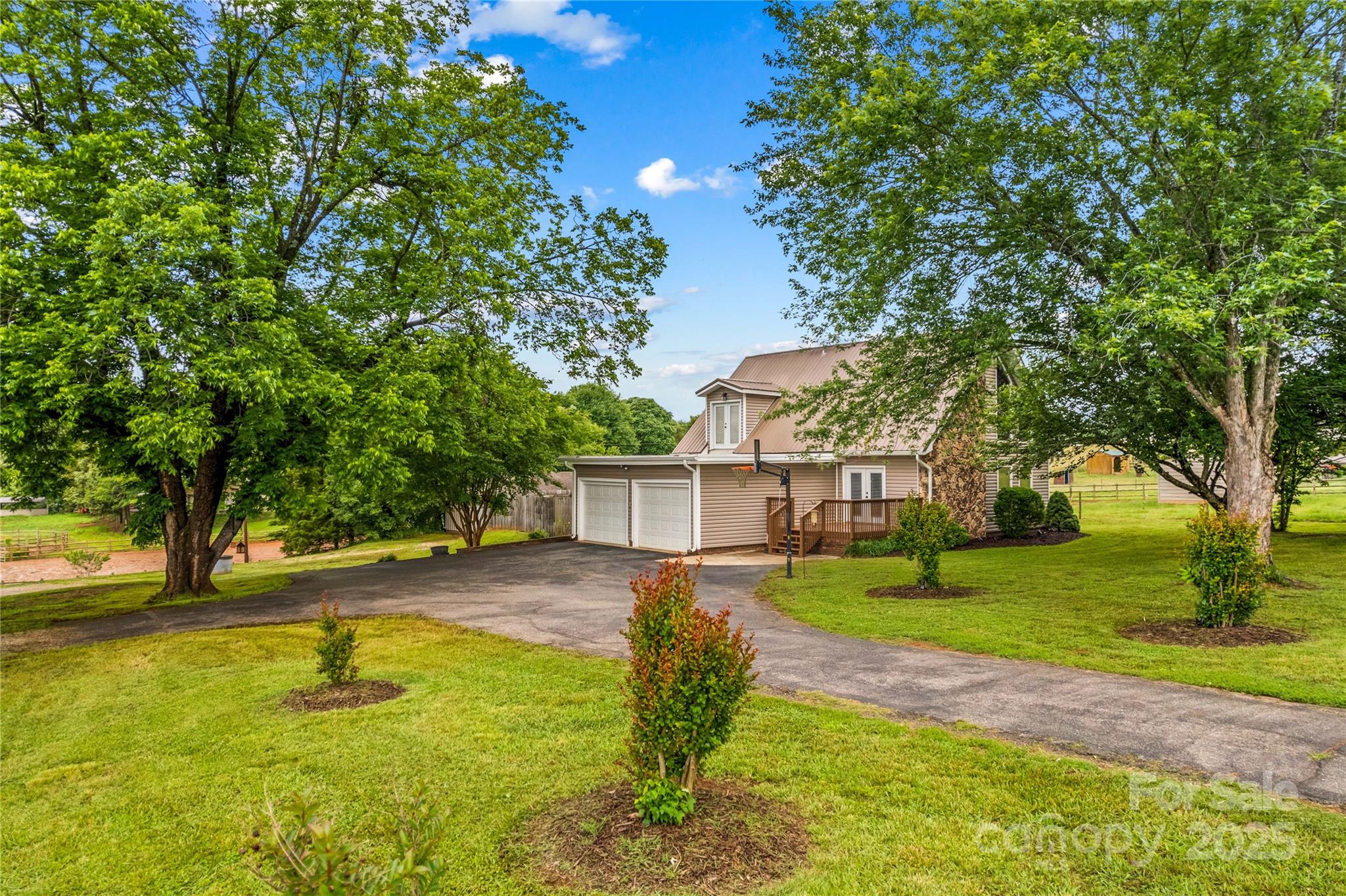 296 Hicks Creek Road Troutman, NC 28166 - Photo 2 of 48 a view of a backyard with swimming pool