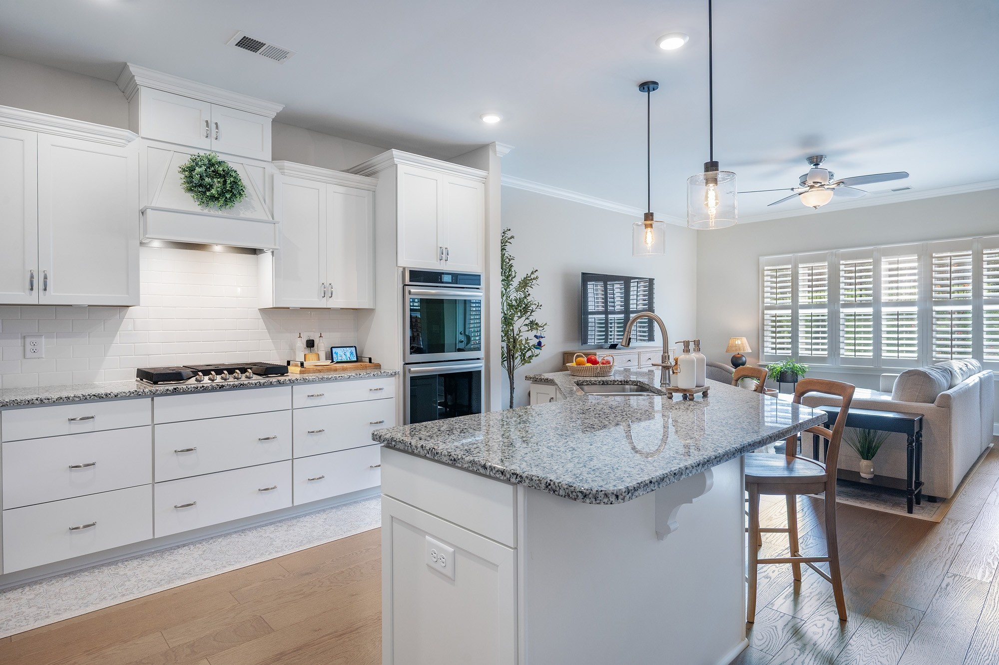 1519 Cedarbrooke Lane Lebanon, TN 37090 - Photo 1 of 45 a kitchen with kitchen island granite countertop a stove a sink a dining table and chairs with wooden floor