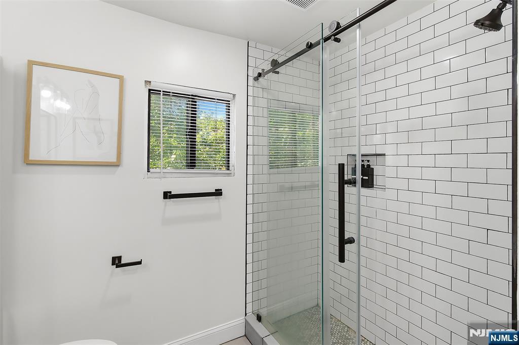 22 8th Avenue Newark, NJ 07104 - Photo 21 of 26 a bathroom with a shower