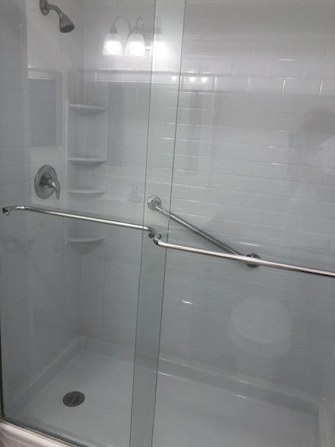 9273 Southwest 8th Street, Unit 417 Boca Raton, FL 33428 - Photo 18 of 25 a bathroom with a shower