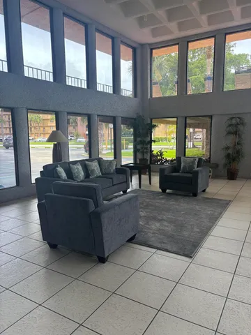 a living room with furniture and windows