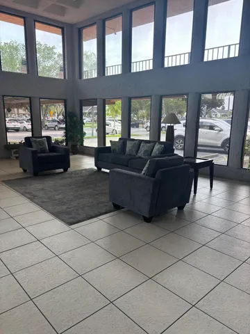 a living room with furniture and windows