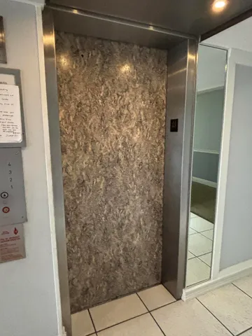 a bathroom with a glass door shower