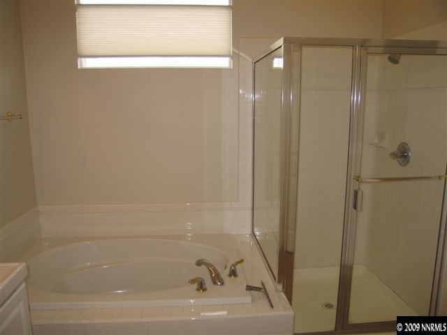 1681 Dutch Ravine Court Reno, NV 89521 - Photo 8 of 9 a bathroom with a bathtub